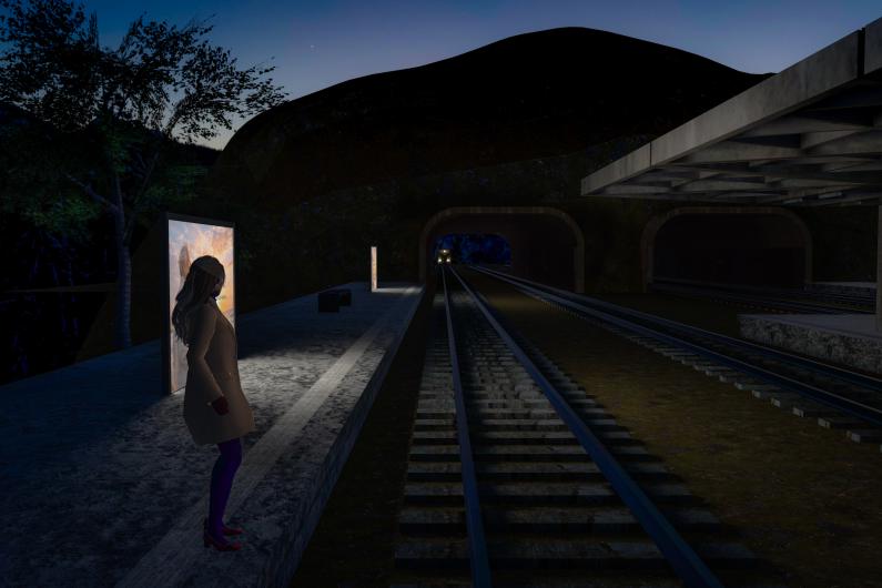 A lone figure stands on a dark platform, looking along the tracks towards a tunnel or distant station. Illuminated advertising panels glow beside the figure, while the surroundings are dominated by deep blue and black tones. The station roof extends into the frame on the right, with trees and rock formations shaping the left side. The scene conveys solitude, waiting and stillness at night.
