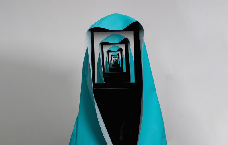 A figure draped in a turquoise cloth appears to hold a digital screen over its face. The screen displays a repeating recursive image of the same figure, giving a tunnel-like, infinite reflection effect.